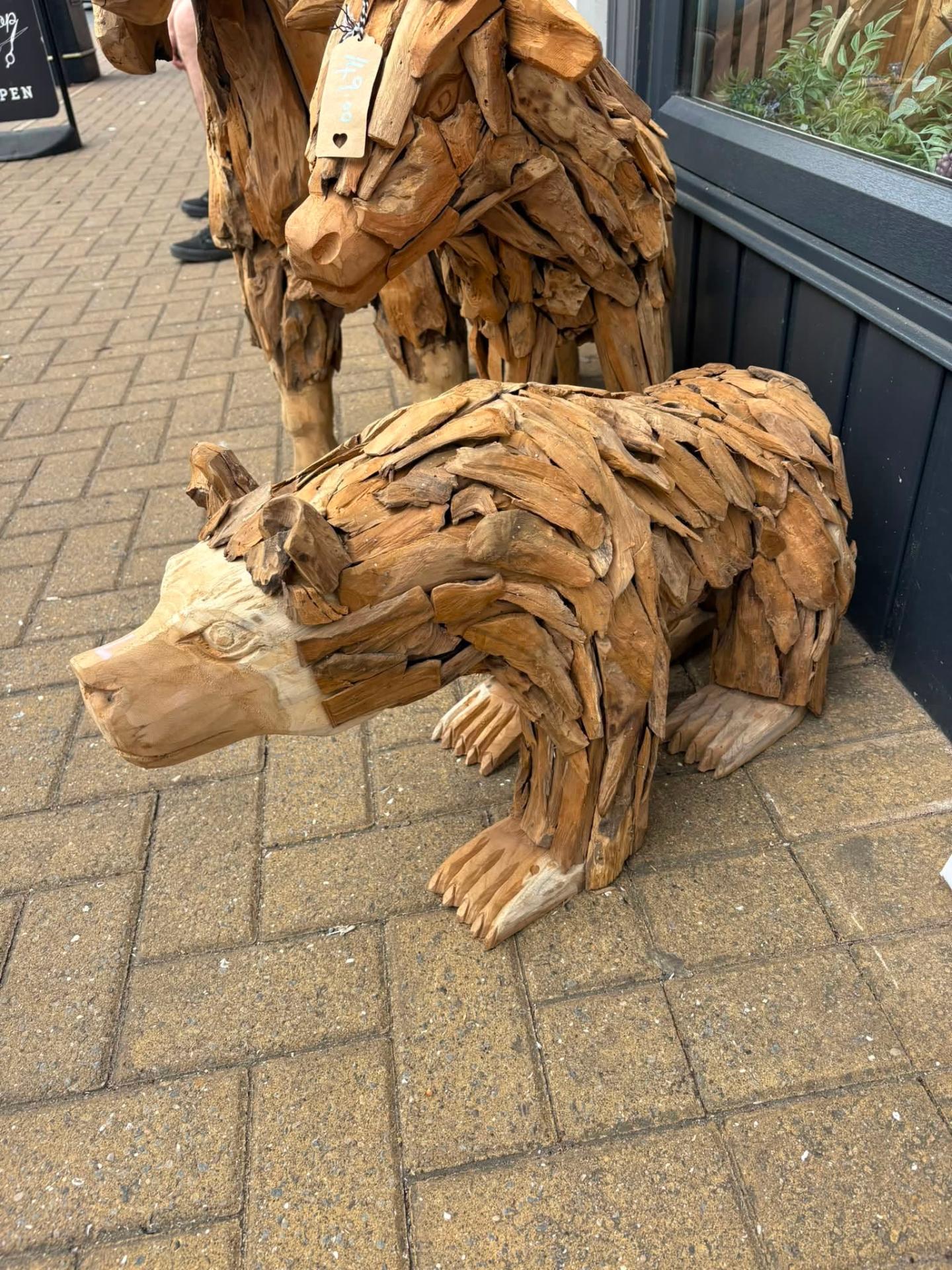 Life-sized hand-carved teak peacock sculpture